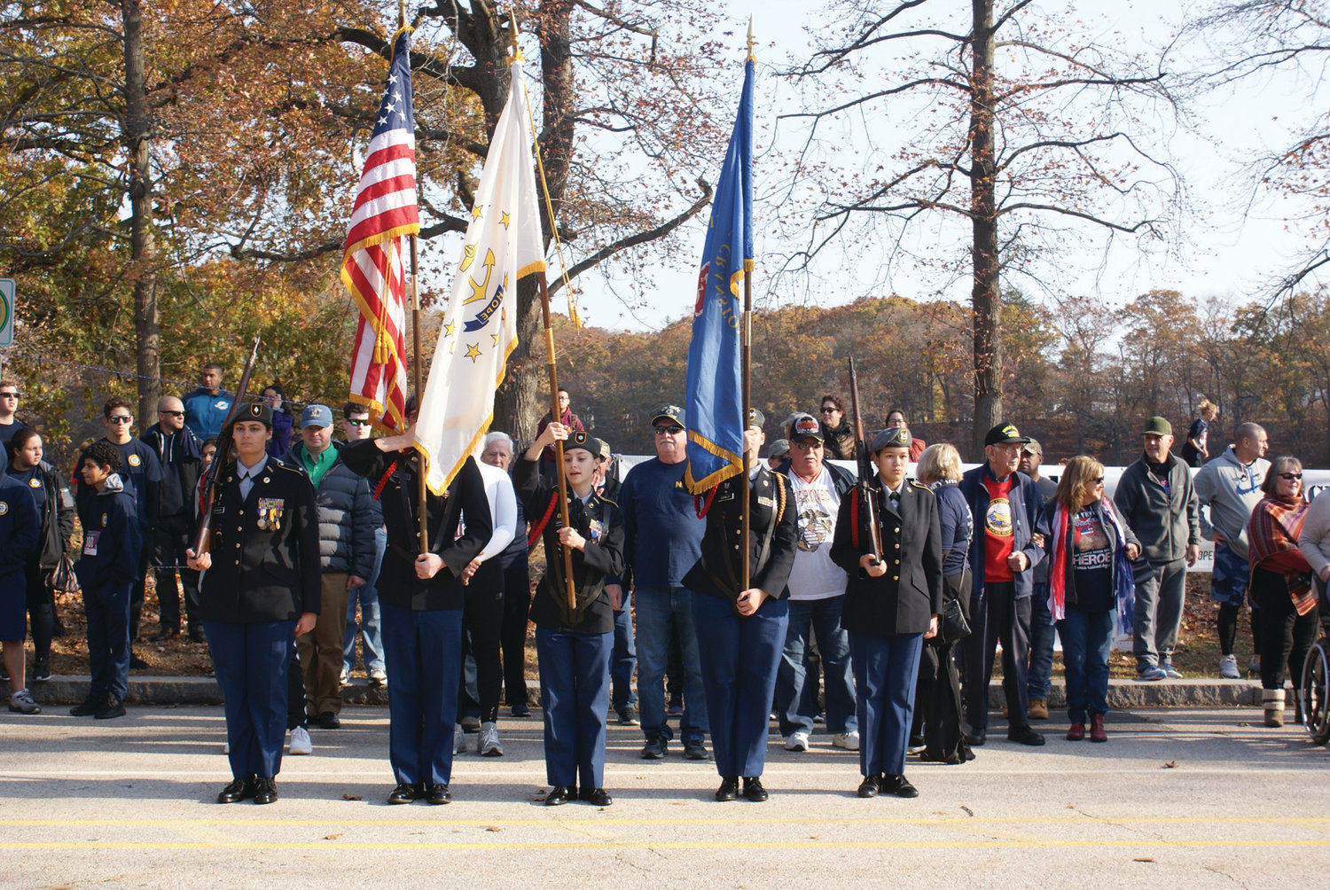 STEPPING OFF: The Cranston High School East JROTC led the way with veterans, dignitaries and special guests prior to the running of the seventh annual Park View Veterans Day 5K on Monday.